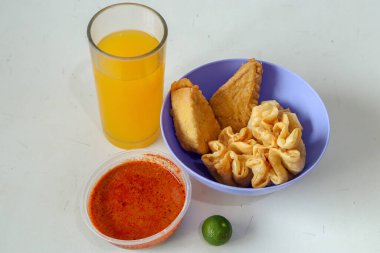 Batagor and Siomay with Peanut Sauce and Orange Juice a traditional Indonesian dish from Bandung clipart