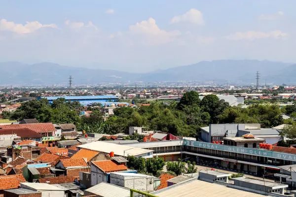 stock image Bandung, Indonesia - June 6th 2024 : An aerial view of a densely populated urban area in Southeast Asia, Cibaduyut Indonesia, showcasing a sea of ceramic tiled rooftops