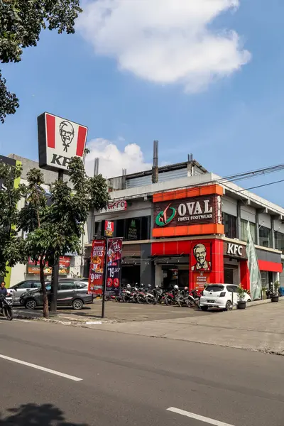 stock image Bandung, Indonesia - July 9th 2024 : KFC Kentucky Fried Chicken outlet located in shopping district of Cibaduyut, known for its handcrafted shoe shops, Oval shop, in M-Square Commercial and Suite area