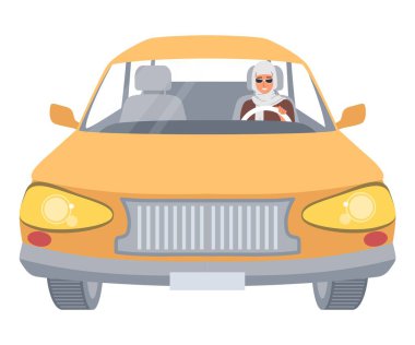 Şık güneş gözlüğü takan genç bir Müslüman kadının parlak turuncu bir arabayı gün ışığında canlı bir şehir ortamında sürdüğü görülüyor. Güven ve modernlik yayıyor..