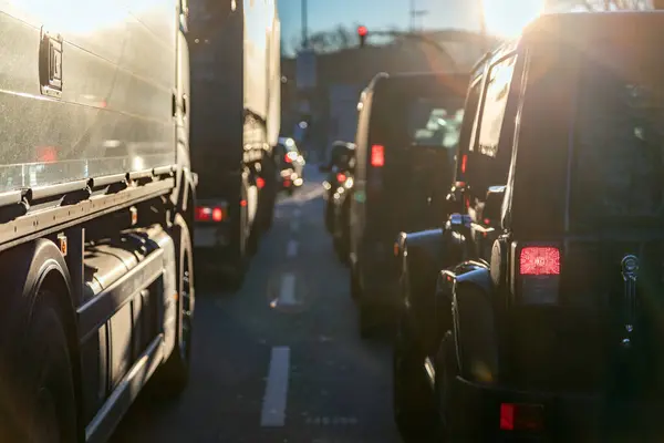 Morning traffic jam scene with SUV and truck