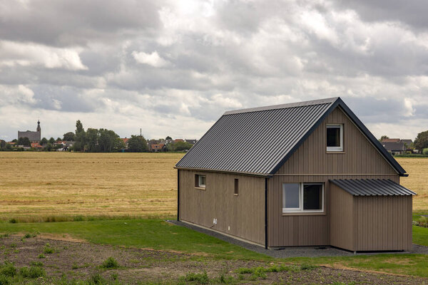 simple house on the edge of a field