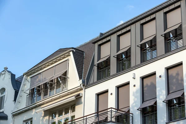 gray sunshades on the windows of Hamburg city villas