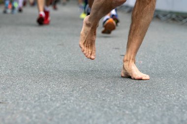 barefoot runner at the Hamburg marathon clipart