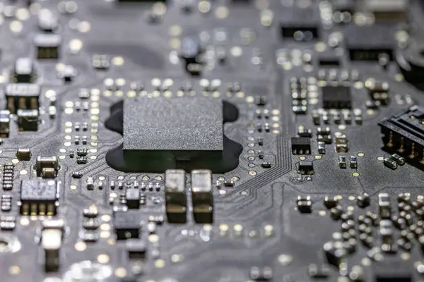 stock image Microprocessor on computer board in backlight