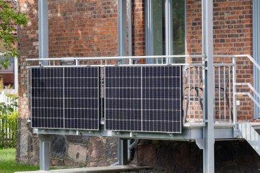 solar panels on the balcony on the ground floor clipart