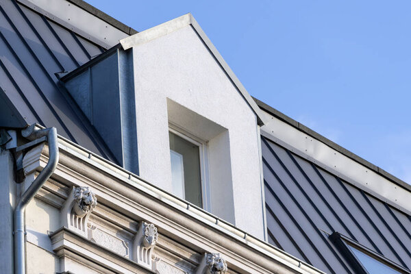 Insulated gable dormer in the converted attic of an old building