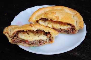 Minced Beef Pie on black background