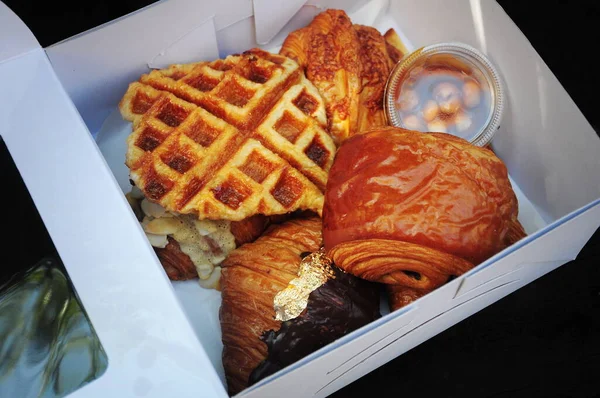Croissants and Pastries in paper box