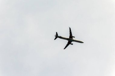 A jet plane flying in the sky. Transportation.