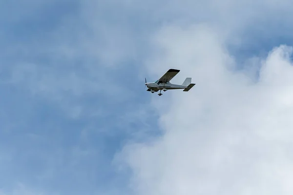 stock image Small plane. A single engine plane crosses the blue sky. Transportation.