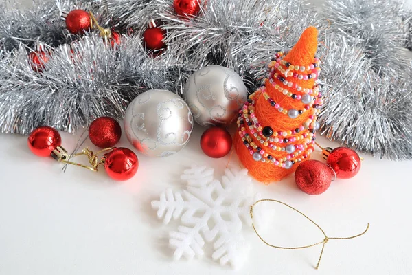 Christmas background with red and silver baubles on the white background