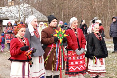 Singing Ukrainian carols for Christmas in skansen Pirogovo in Kyiv, Ukraine