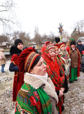 Singing Ukrainian carols for Christmas in skansen Pirogovo in Kyiv, Ukraine