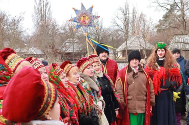 Singing Ukrainian carols for Christmas in skansen Pirogovo in Kyiv, Ukraine
