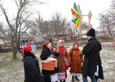 Singing Ukrainian carols for Christmas in skansen Pirogovo in Kyiv, Ukraine