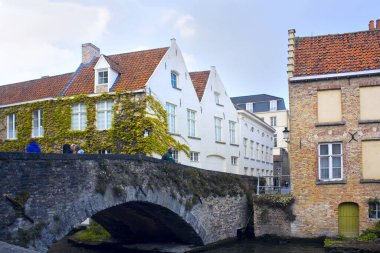 Water canal and stone old bridge in Brugge, Belgium