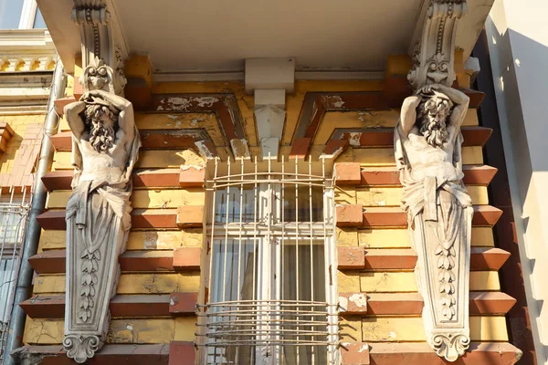 Rich decoration of old house with Atlanteans in Odessa, Ukraine