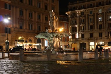 Fountain of Triton at night time in Rome, Italy clipart