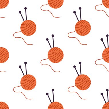 Örgü topuyla kusursuz desen ve beyaz arka planda örgü iğneleri..