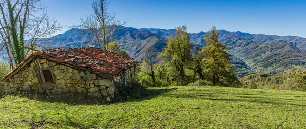 Landscape with stone cabin in meadow of the council of Teverga, Teberga in the natural park Las Ubinas La Mesa, in Asturias. High quality photo