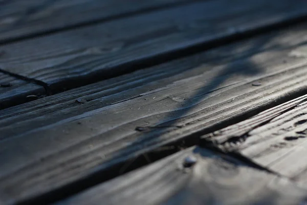 stock image Wooden balcony with sunlight in the back in the morning, deep off-field, wood texture, brown wooden balcony.