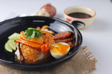 Barbecued red pork in sauce with rice served in the restaurant. There are many sold in Thailand.Barbecued red pork in sauce with rice is a popular food in Thailand.