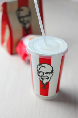 Bangkok, Thailand - January, 10 2023 : KFC Chicken Burger or Singer Burger served with soft drinks and french fries, KFC is a popular fast food in Thailand.