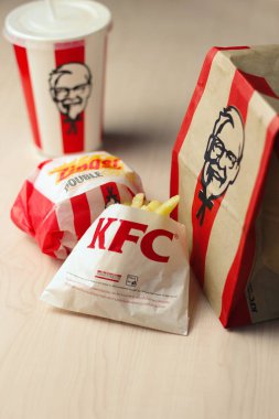 Bangkok, Thailand - January, 10 2023 : KFC Chicken Burger or Singer Burger served with soft drinks and french fries, KFC is a popular fast food in Thailand.