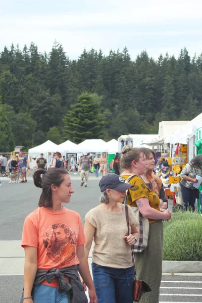 stock image Sequim, WA - JULY 17 2022 : People having fun at the Sequim Farm Lavander Festivals with merchandise, music, and events during the American summer.