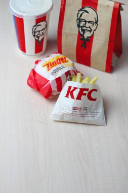 Bangkok, Thailand - January, 10 2023 : KFC Chicken Burger or Singer Burger served with soft drinks and french fries, KFC is a popular fast food in Thailand.