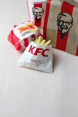 Bangkok, Thailand - January, 10 2023 : KFC Chicken Burger or Singer Burger served with soft drinks and french fries, KFC is a popular fast food in Thailand.