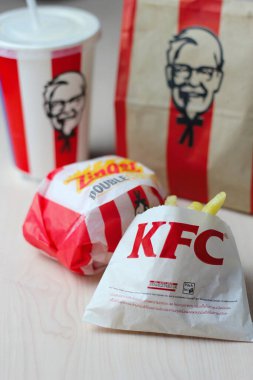 Bangkok, Thailand - January, 10 2023 : KFC Chicken Burger or Singer Burger served with soft drinks and french fries, KFC is a popular fast food in Thailand.