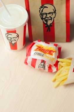 Bangkok, Thailand - January, 10 2023 : KFC Chicken Burger or Singer Burger served with soft drinks and french fries, KFC is a popular fast food in Thailand.