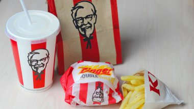 Bangkok, Thailand - January, 10 2023 : KFC Chicken Burger or Singer Burger served with soft drinks and french fries, KFC is a popular fast food in Thailand.