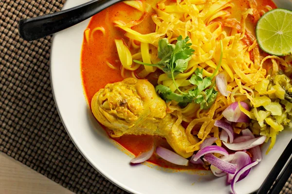 stock image Khao soy Recipe, Curried Noodle Soup with Chicken Served on white Bowl, Thai Food, Curry Noodle, Thai Noodle, Northern Food.