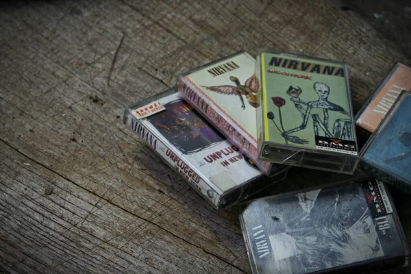 stock image America, Washington State - September 08 2023 : Nirvana cassette tape on wooden floor, Nirvana band, Kurt Cobain, Nirvana songs, In Uthro