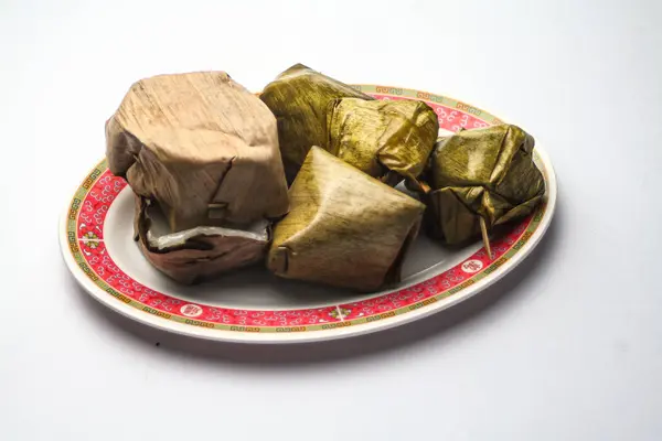 stock image Stuffed Dough Pyramid Dessert and Nian Gao or Chinese new year's rice cake on Chinese style plate