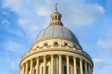 This landscape photo was taken, in Europe, in France, in ile de France, in Paris, in summer. We see the Pantheon, under the Sun. clipart