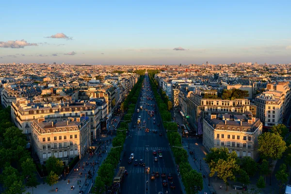 stock image This landscape photo was taken, in Europe, in France, in ile de France, in Paris, in summer. We see the Avenue des Champs-elysees, under the Sun.