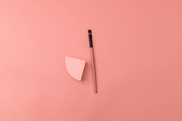 Tweezers for hands, pink on pink background - monochrome