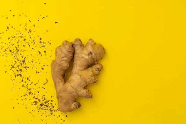 Ginger root on yellow background