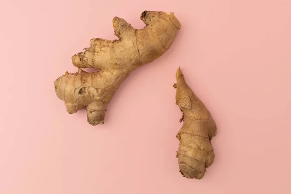 Ginger root on a pink background