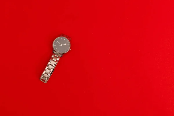 Wristwatch on red background, object photography for advertising