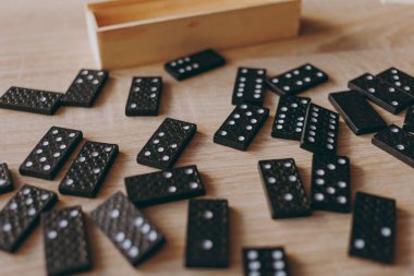 Dominoes in a wooden box, a game for two