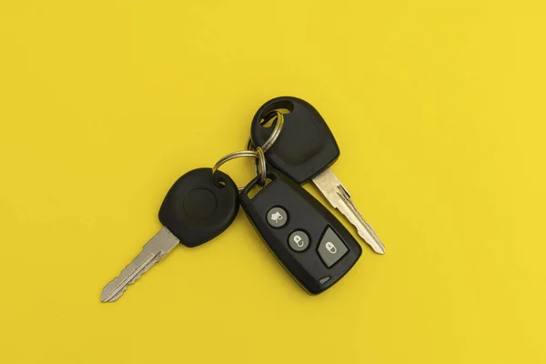 Car keys on yellow background