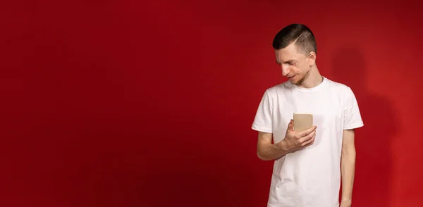 stock image Banner with a man holding a phone and looking away