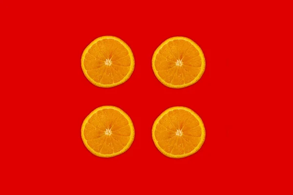 Collage Met Sinaasappels Een Rode Achtergrond — Stockfoto