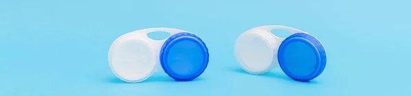 Blue banner with lens containers