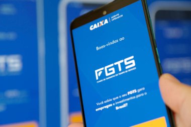 Bir cep telefonu ekranında mavi arkaplan ile Caixa fgts uygulaması.